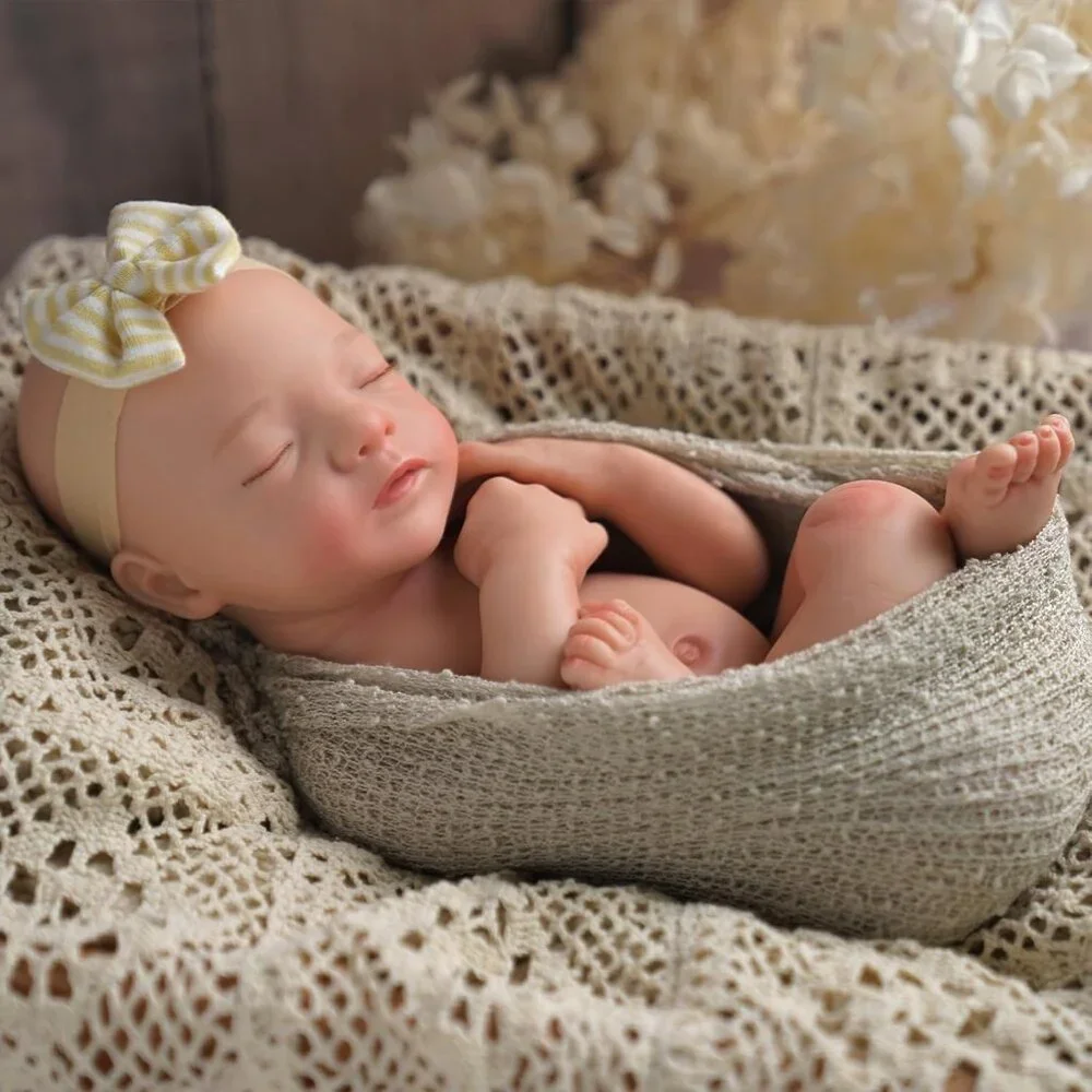 Realistic Baby Doll in Beige Knit Swaddle with Cream & Yellow Bow